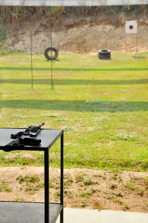 M4A1 carbine rifle on a table in the yard shooting の写真素材