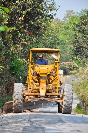 Graders are commonly used in the construction and maintenance of dirt roads and gravel roads の写真素材