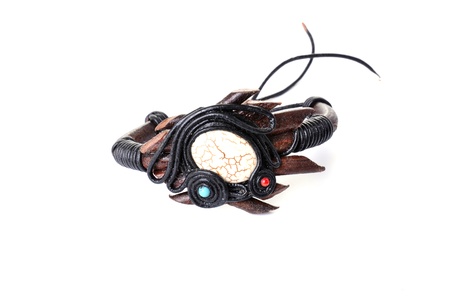 Bracelet made of leather and decorated with colored stones の写真素材
