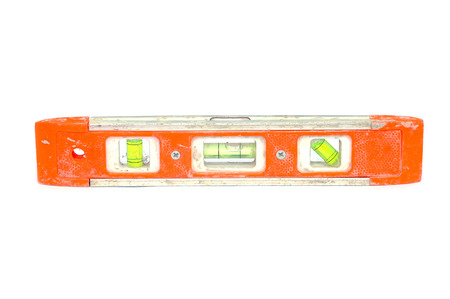 Old orange level with bubble isolated on white background.