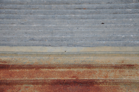 New and old corrugated zinc sheets are laid to overlap の写真素材
