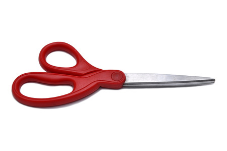 Red scissor isolated on white backgroundの写真素材