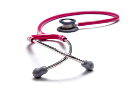 Pink colour stethoscopes isolated on white backgroundの写真素材