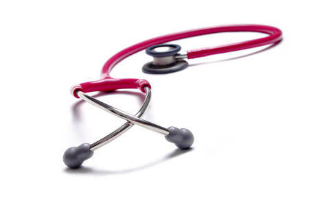 Pink color stethoscopes isolated on white の写真素材