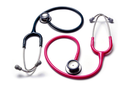 Black and pink stethoscopes isolated on white backgroundの写真素材