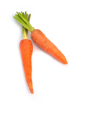 The fresh baby carrot on white の写真素材