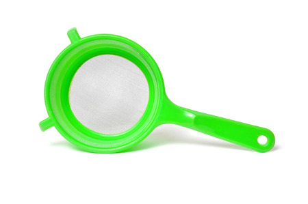 Green handle colander isolated on white backgroundの写真素材