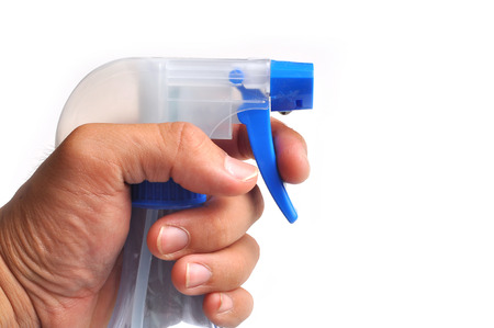 foggy sprayer in hand isolated on white background.の写真素材