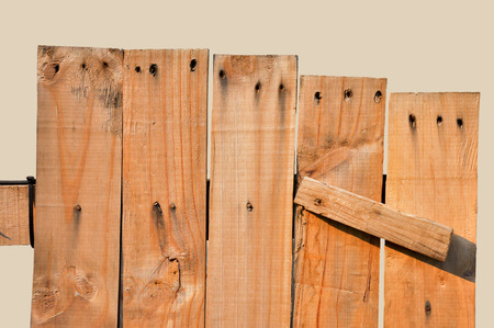 Plank was introduced to as a fence, which isolated on brown background.の写真素材