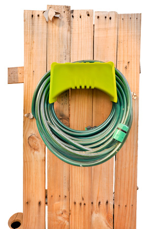 Hoses are rolled up in storage which isolated on white background.の写真素材