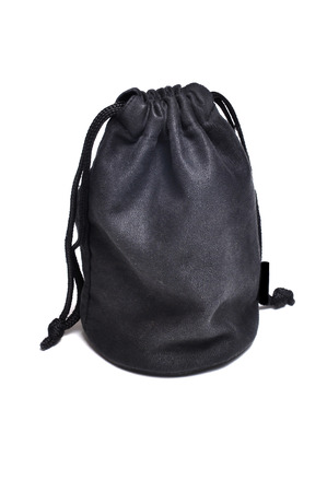 Black suede bag isolated on white background.の写真素材