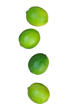four fresh limes isolated on white background.の写真素材