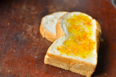 Whole wheat bread, brush with orange marmalade.の写真素材