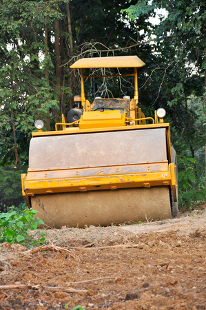 Road rollers use the weight of the vehicle to compress the surface being rolledの写真素材