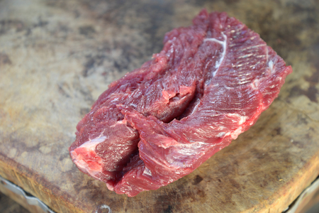 Fresh beef on wooden cutting boardの写真素材