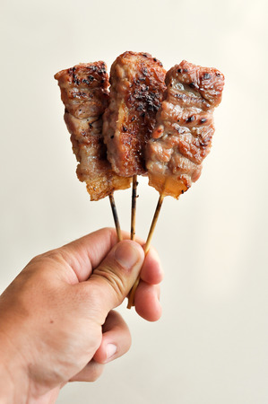 Roasted  Pork with bamboo stickの写真素材