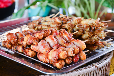 Roasted Sausage with bacon with bamboo stickの写真素材