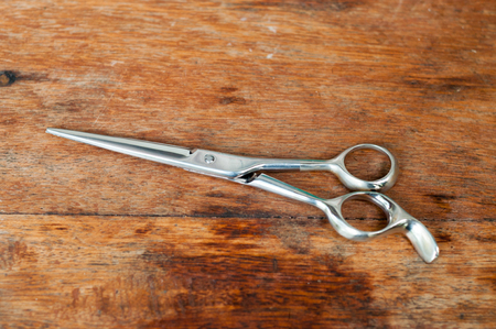 Barber scissors  on wooden tableの写真素材