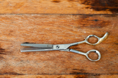 Barber scissors  on wooden tableの写真素材