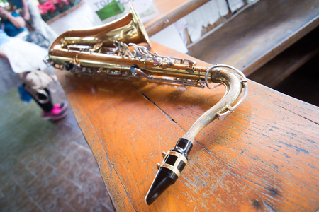Close up of an old saxophone of a marching band musician.の写真素材