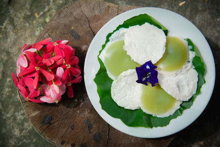 Steamed Coconut Milk Custard (Kanom Touy) have two layers. The first layer is a mixture of flour, coconut milk. Coconut Sugar and Pandan Juice The second layer is a mixture of flour, coconut milk and salt.の写真素材