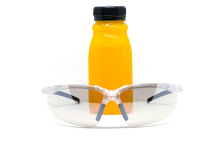 Fresh orange juice in bottleの写真素材
