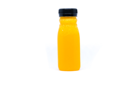 Fresh orange juice in bottleの写真素材