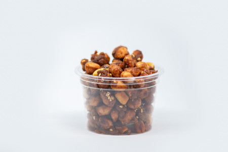 Crispy Sugared Peanut are a sweet and crunchy snack. Crispy Sugared Peanut isolated on white backgroundの写真素材