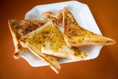 Triangular garlic bread for breakfastの写真素材