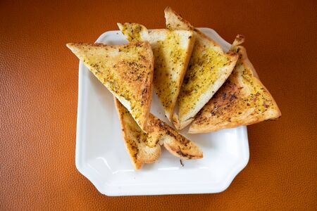 Triangular garlic bread for breakfastの写真素材