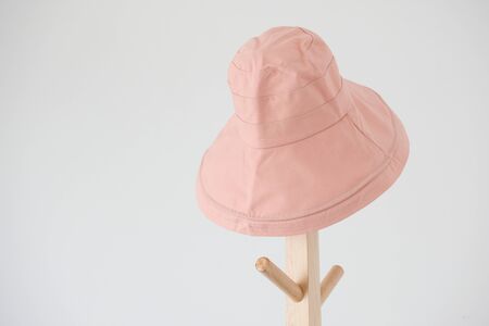 Wide brimmed sun hat on the coat rackの写真素材