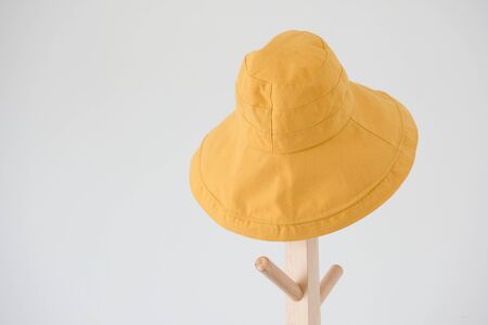 Wide brimmed sun hat on the coat rackの写真素材