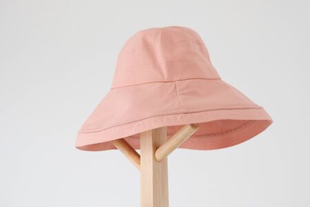 Wide brimmed sun hat on the coat rackの写真素材