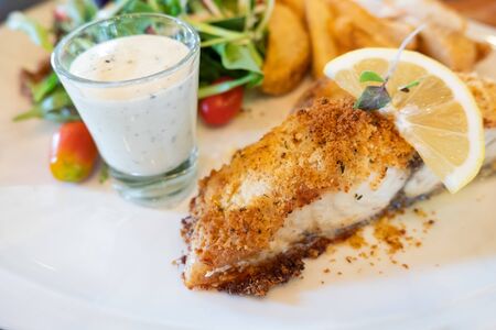 Grilled fish steak with saladの写真素材