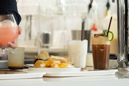 Beverage ordered by customers on the bar waiting to be served to customersの写真素材