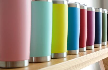 Various colors of stainless steel tumblers are used to keep cool or hot. Help reduce global warming.の写真素材