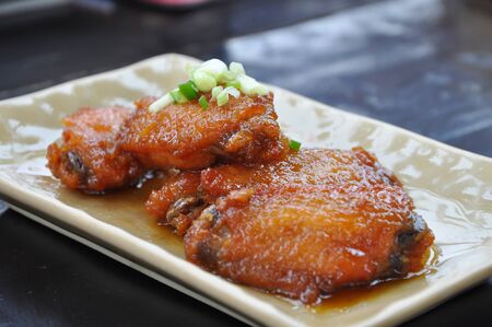 Fried chicken wings with fish sauceの写真素材