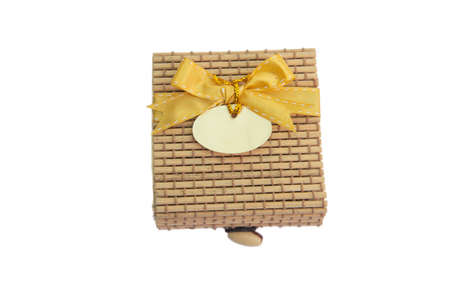 bamboo gift box with gold ribbon and tagの写真素材