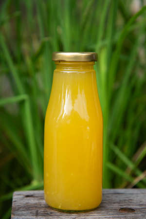 Fresh pineapple juice in bottled, produced from an organic pineapple farm.の写真素材