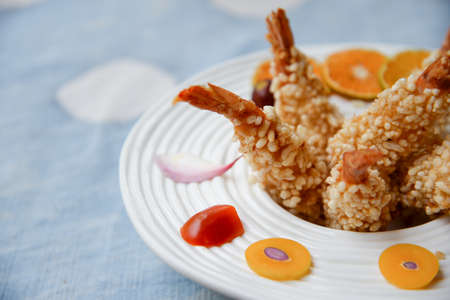Fried prawn with puffed rice on lunch tableの写真素材