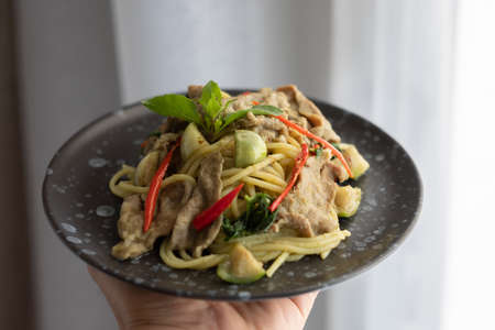 Green Curry Pork Spaghetti, Fusion food between Thai and Italian ingredientsの写真素材