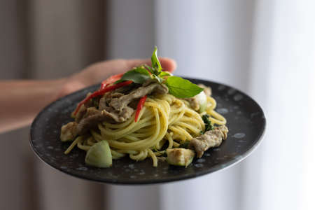 Green Curry Pork Spaghetti, Fusion food between Thai and Italian ingredientsの写真素材