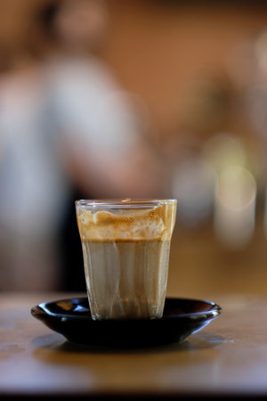 Coffee menu that is served separately Between the cold fresh milk at the bottom of the glass And topped with Espresso or Ristretto shot on top without iceの写真素材