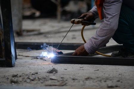 The laborer is welding steel in the construction.の写真素材