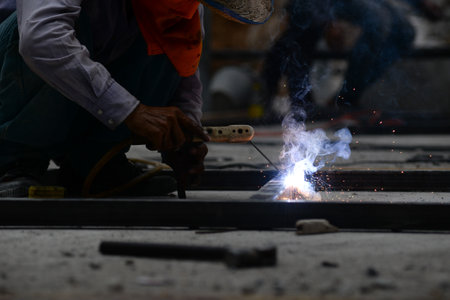 The laborer is welding steel in the construction.の写真素材