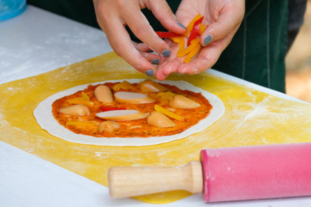 Chef makes homemade pizza for the holidays. Classic Italian Pizza with Sausage and Mozzarella Cheeseの写真素材