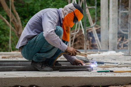 The laborer is welding steel in the construction.の写真素材
