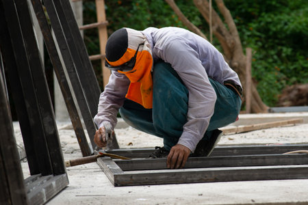 The laborer is welding steel in the construction.の写真素材