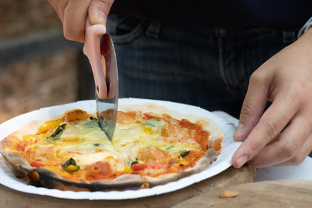 Homemade classic italian pizza. Chef makes homemade pizza on the holidays.
