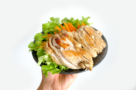 Grilled boneless breast on black dishの写真素材
